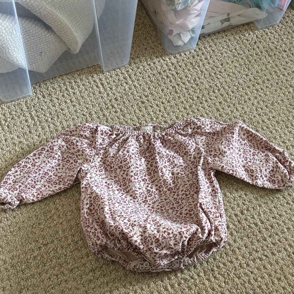 Tullabe long sleeve onesie.